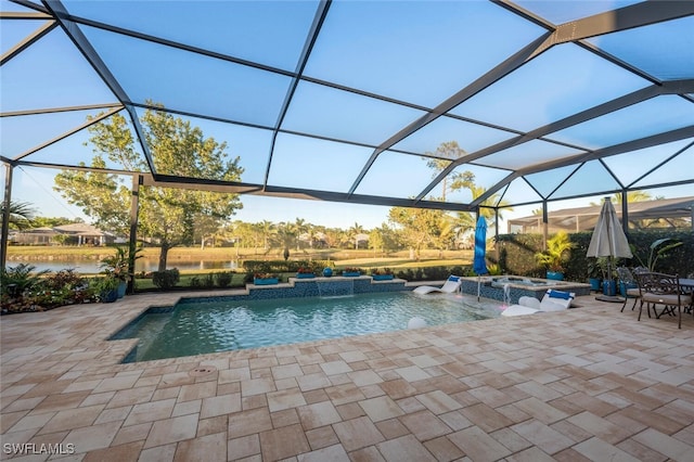 view of pool featuring a lanai, pool water feature, a patio area, and an in ground hot tub