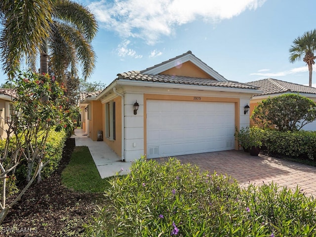 view of front of property with a garage