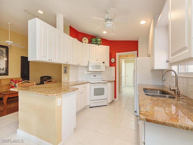 kitchen with ceiling fan, white cabinetry, kitchen peninsula, and white appliances