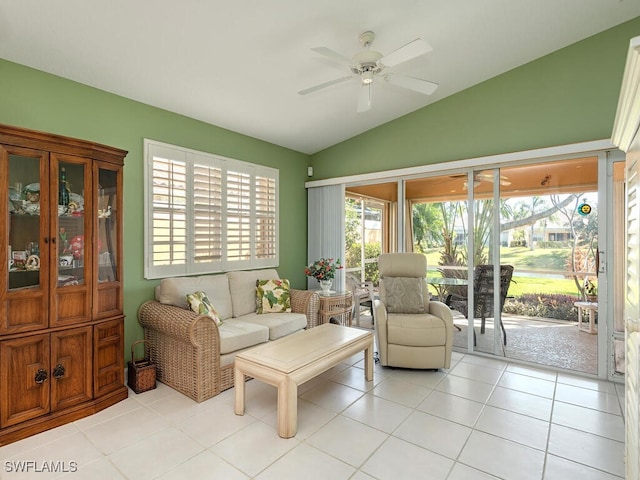 tiled living room featuring ceiling fan and lofted ceiling