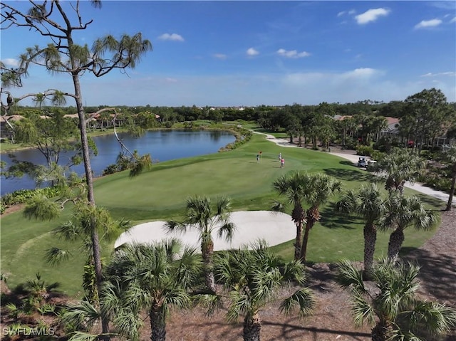 surrounding community featuring view of golf course and a water view