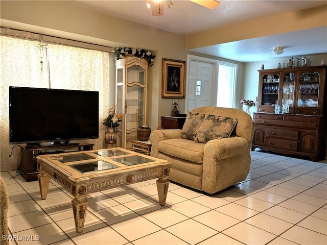 living room with light tile patterned flooring and ceiling fan