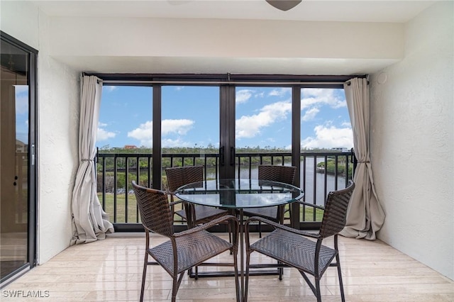 sunroom with a water view