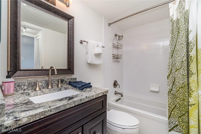 full bathroom featuring toilet, vanity, and shower / bath combo