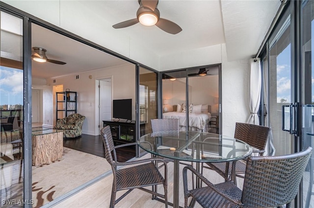 sunroom featuring plenty of natural light and french doors