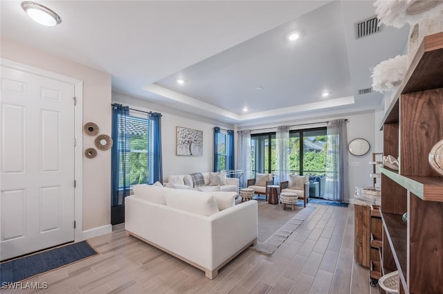 living room with a tray ceiling