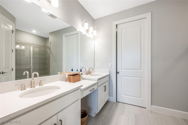 bathroom with an enclosed shower and vanity