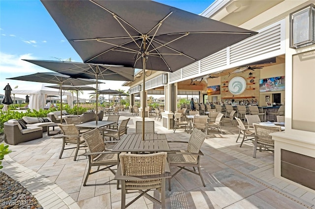 view of patio / terrace with ceiling fan