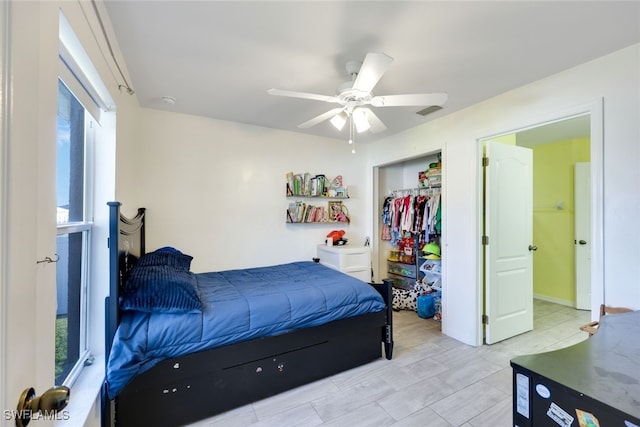 bedroom with ceiling fan and a closet