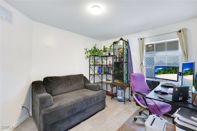 office space with light hardwood / wood-style flooring