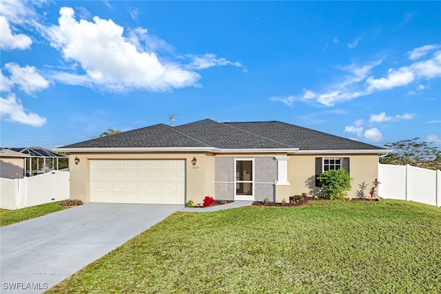 ranch-style home featuring a front lawn and a garage