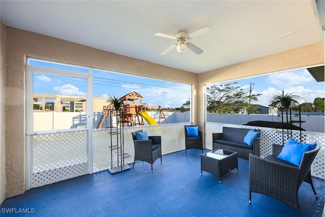 view of patio featuring a playground, ceiling fan, and an outdoor hangout area