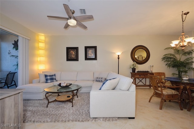 living room featuring ceiling fan with notable chandelier