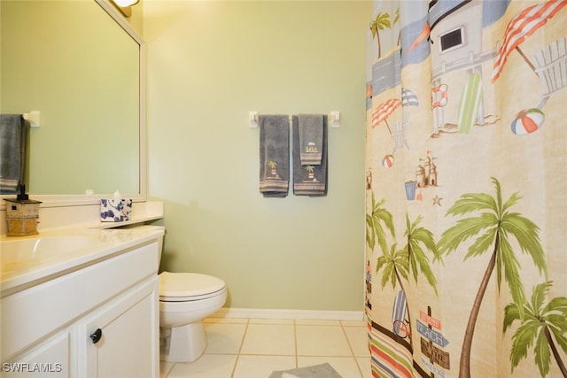 bathroom featuring tile patterned floors, vanity, and toilet