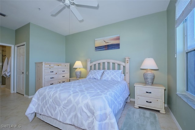 bedroom featuring ceiling fan and a closet