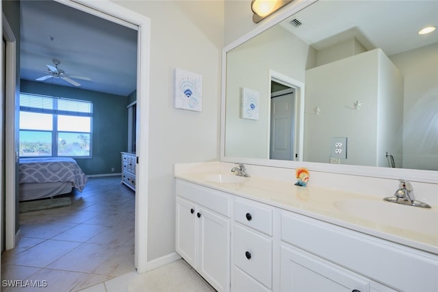 bathroom with ceiling fan, vanity, and tile patterned flooring