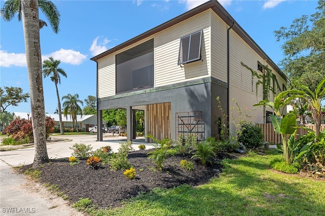 rear view of house with a yard