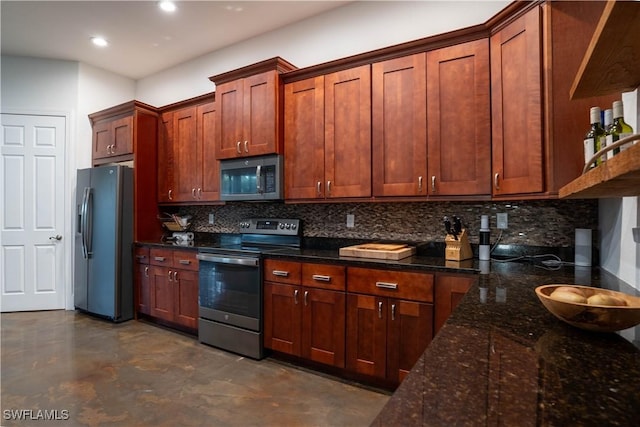 kitchen featuring tasteful backsplash, appliances with stainless steel finishes, and dark stone countertops