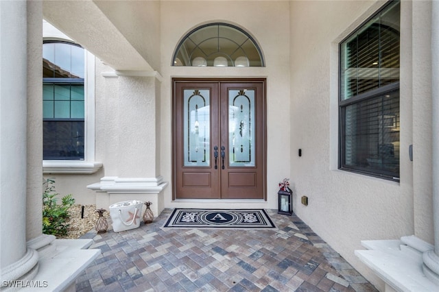 property entrance featuring french doors