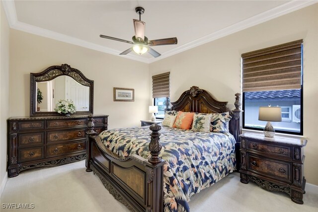 bedroom with ceiling fan, light carpet, and crown molding