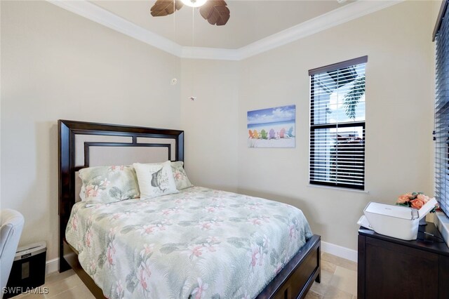 bedroom with ceiling fan and ornamental molding