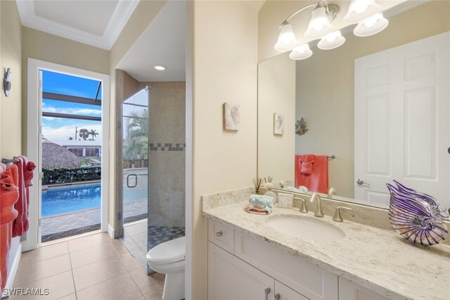 bathroom with crown molding, an enclosed shower, toilet, vanity, and an inviting chandelier