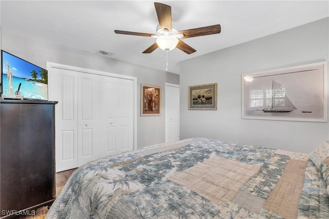 bedroom featuring ceiling fan, hardwood / wood-style flooring, and a closet