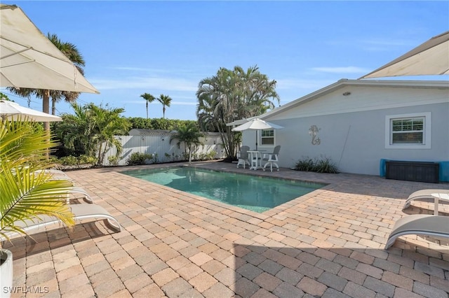 view of swimming pool featuring a patio area