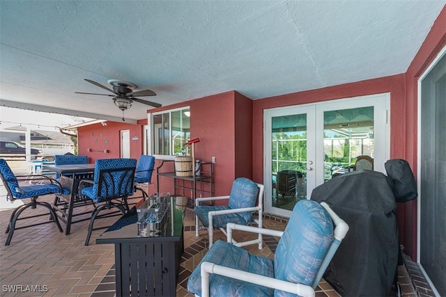 view of patio featuring ceiling fan and french doors