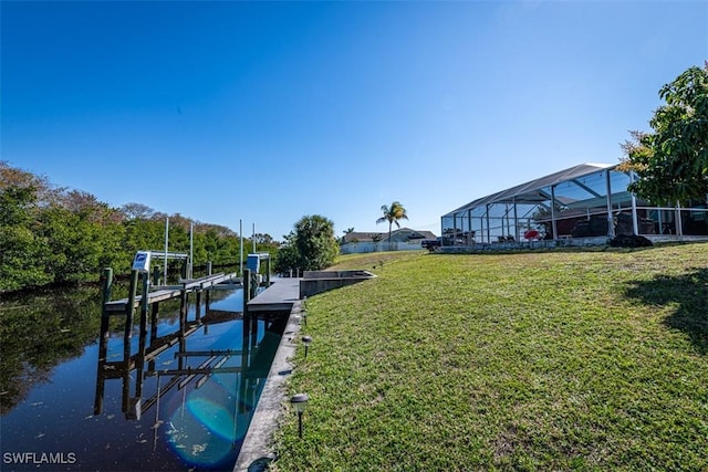 view of dock featuring a yard and a water view