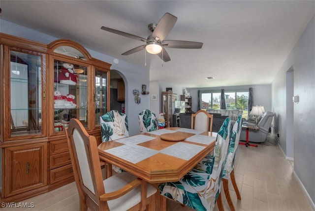 dining space featuring ceiling fan