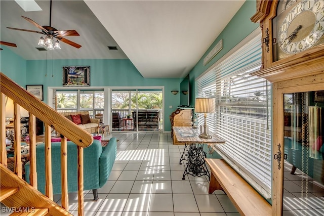 interior space with ceiling fan