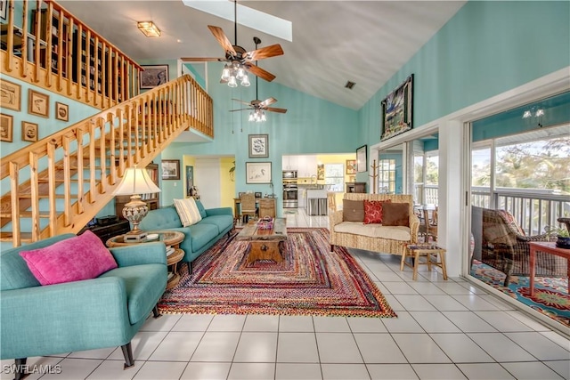 living room with high vaulted ceiling, tile patterned floors, and ceiling fan