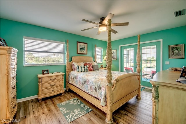 bedroom with ceiling fan, light hardwood / wood-style floors, and access to outside