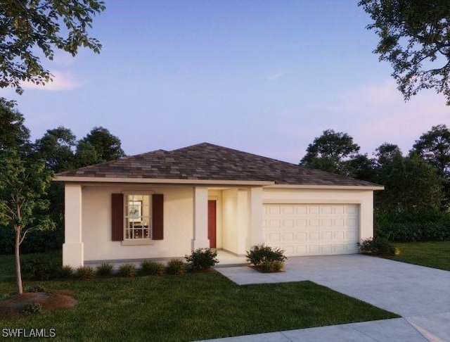 view of front of house with a lawn and a garage