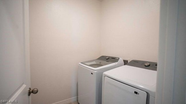 washroom featuring washer and dryer