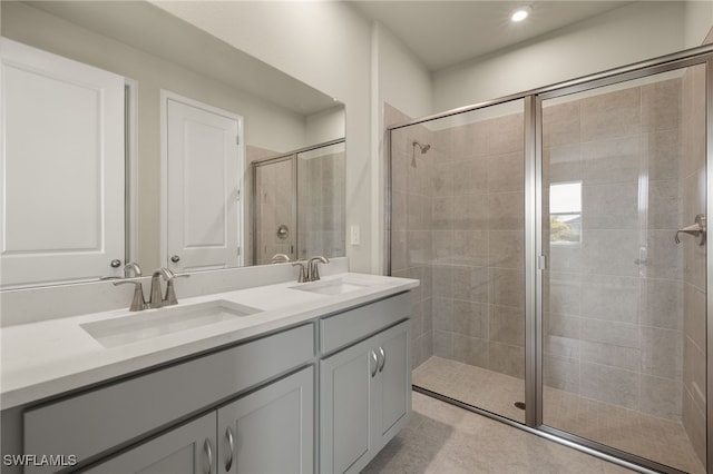 bathroom featuring vanity and a shower with shower door