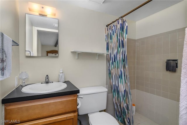 bathroom featuring vanity, curtained shower, and toilet