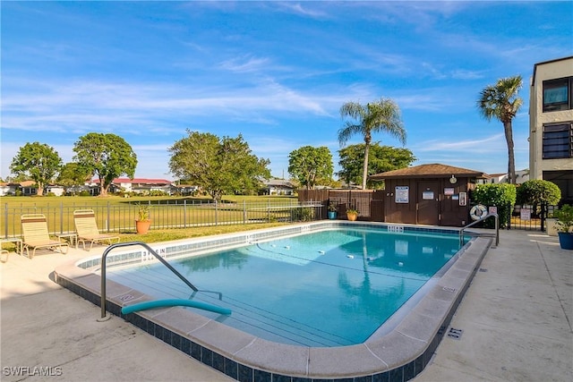 view of swimming pool featuring a patio