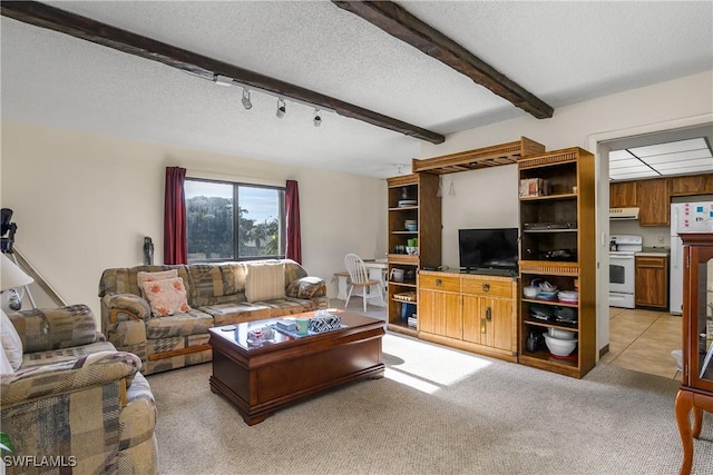 carpeted living room featuring a textured ceiling and beamed ceiling