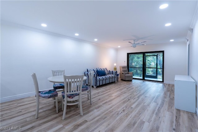 dining area featuring crown molding, ceiling fan, and light hardwood / wood-style flooring