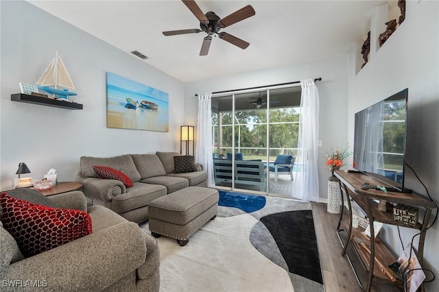 living room featuring ceiling fan and hardwood / wood-style floors