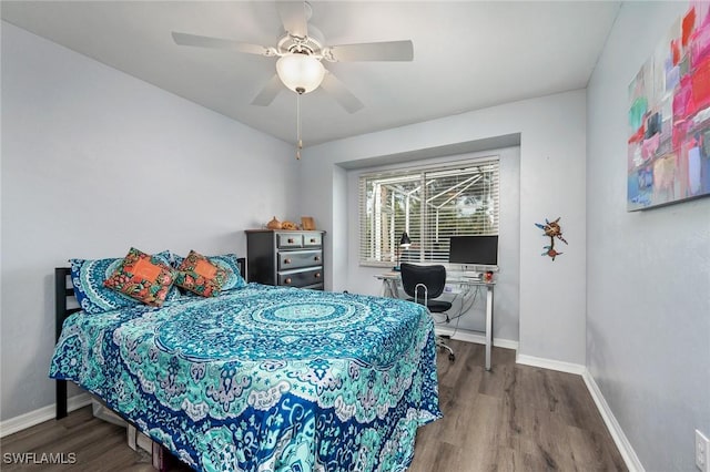 bedroom with ceiling fan and hardwood / wood-style floors