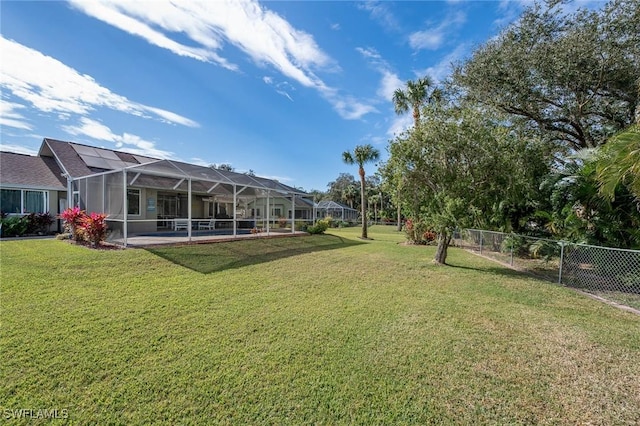 view of yard with a lanai