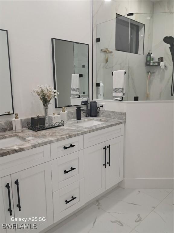 bathroom featuring walk in shower and vanity