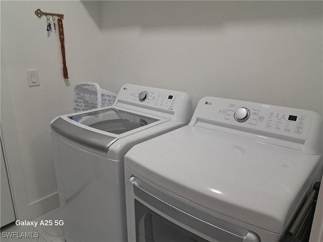 laundry area featuring washing machine and dryer