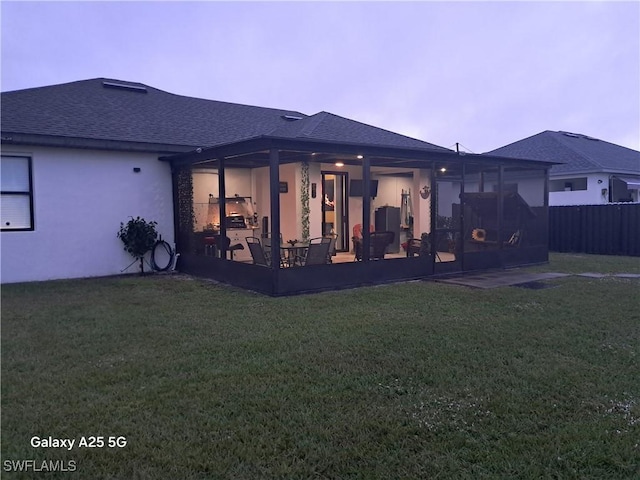 rear view of property with a patio area and a yard