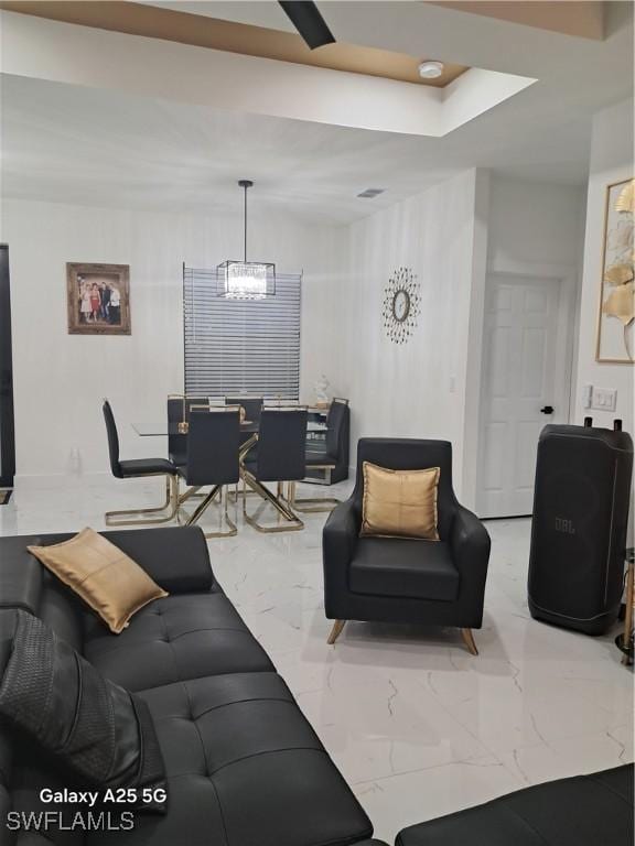 living room with a chandelier