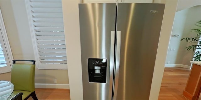 interior details with stainless steel fridge with ice dispenser