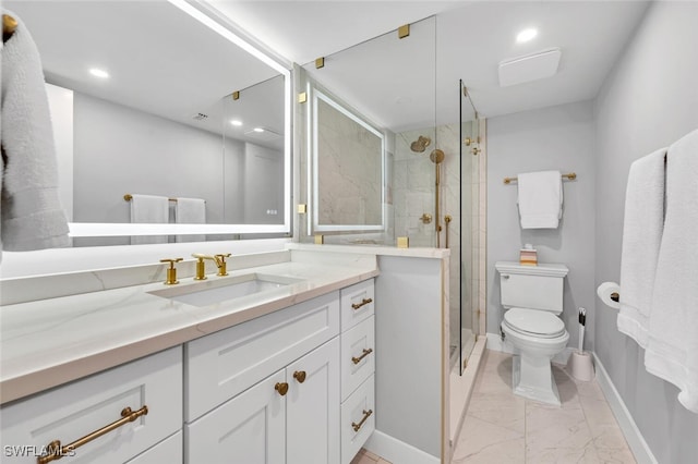 bathroom with a shower with shower door, toilet, and vanity